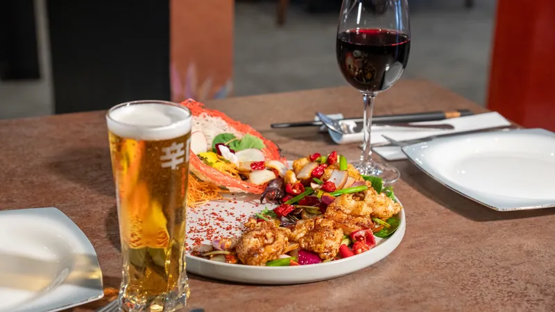 Chilli prawns in a crispy basket with beer and red wine
